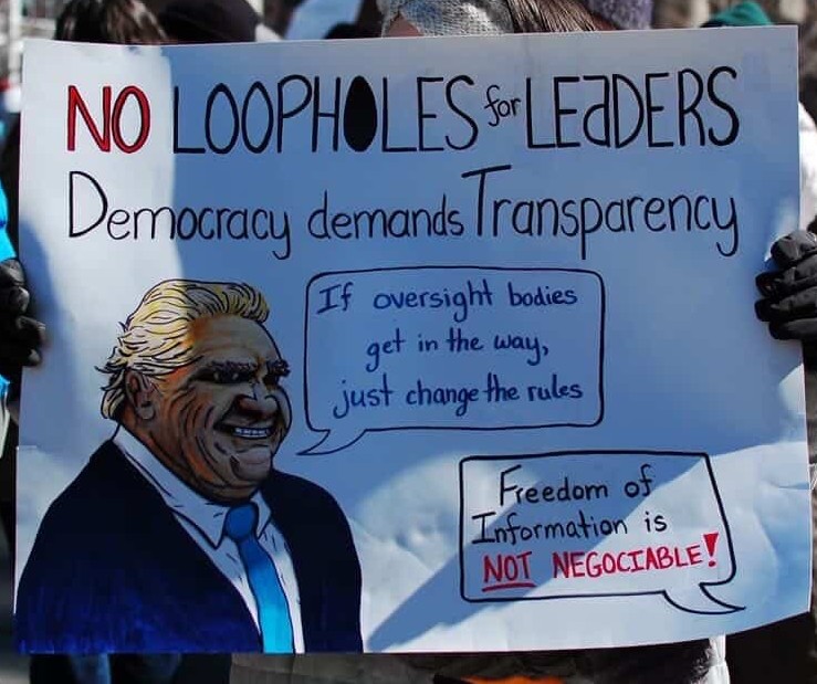 poster saying "no loopholes for leaders. democracy demands transparency." Plus a image of doug ford saying "If oversight bodies get in the way, just change the rules.". Another blurb says "freedom of information is NOT negotiable"
