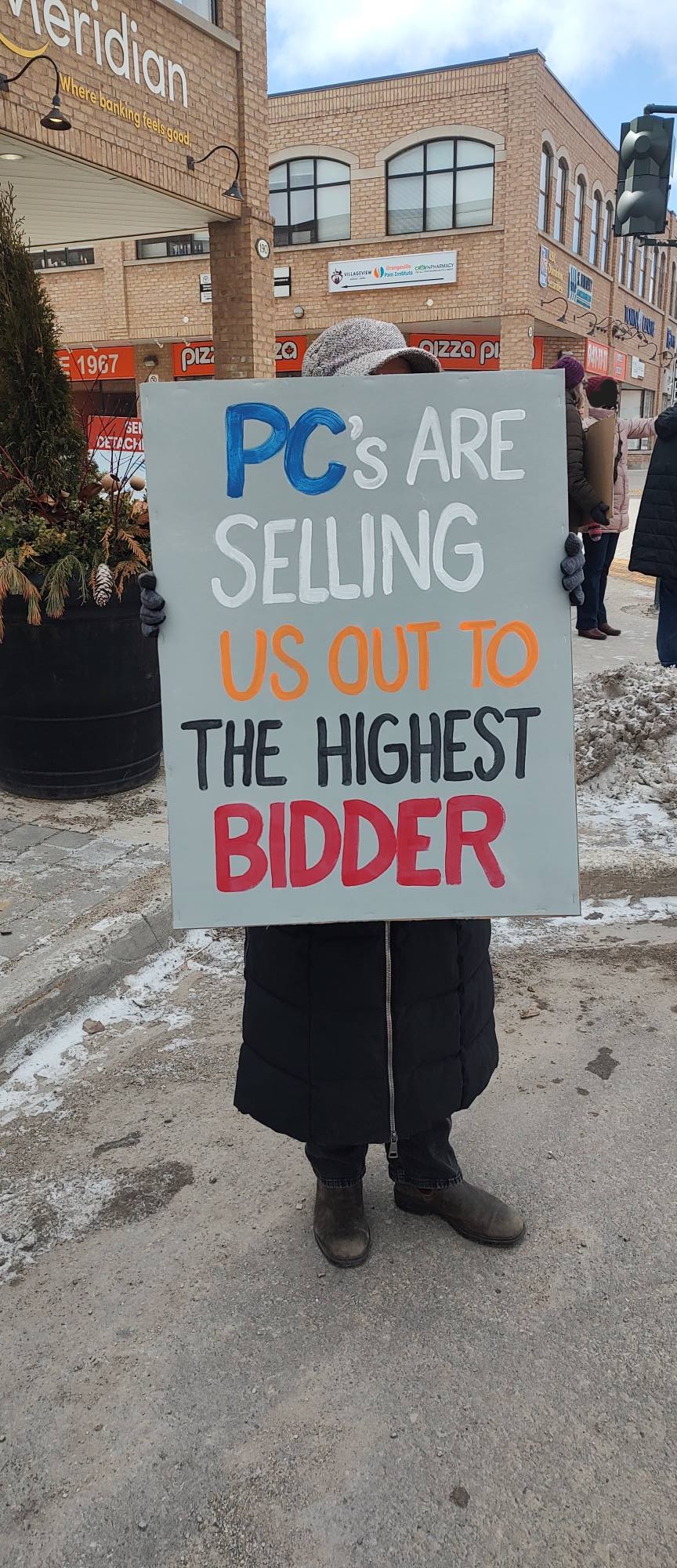 protest poster "pc's are selling us out to the highest bidder"