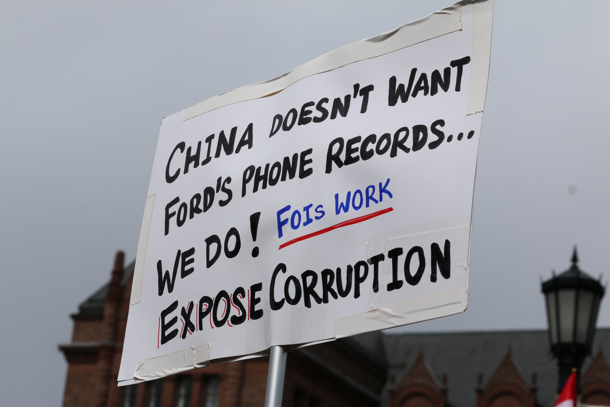 Poster saying "china doesn't want Ford's phone records ... we do! FOIs work. Expose corruption"