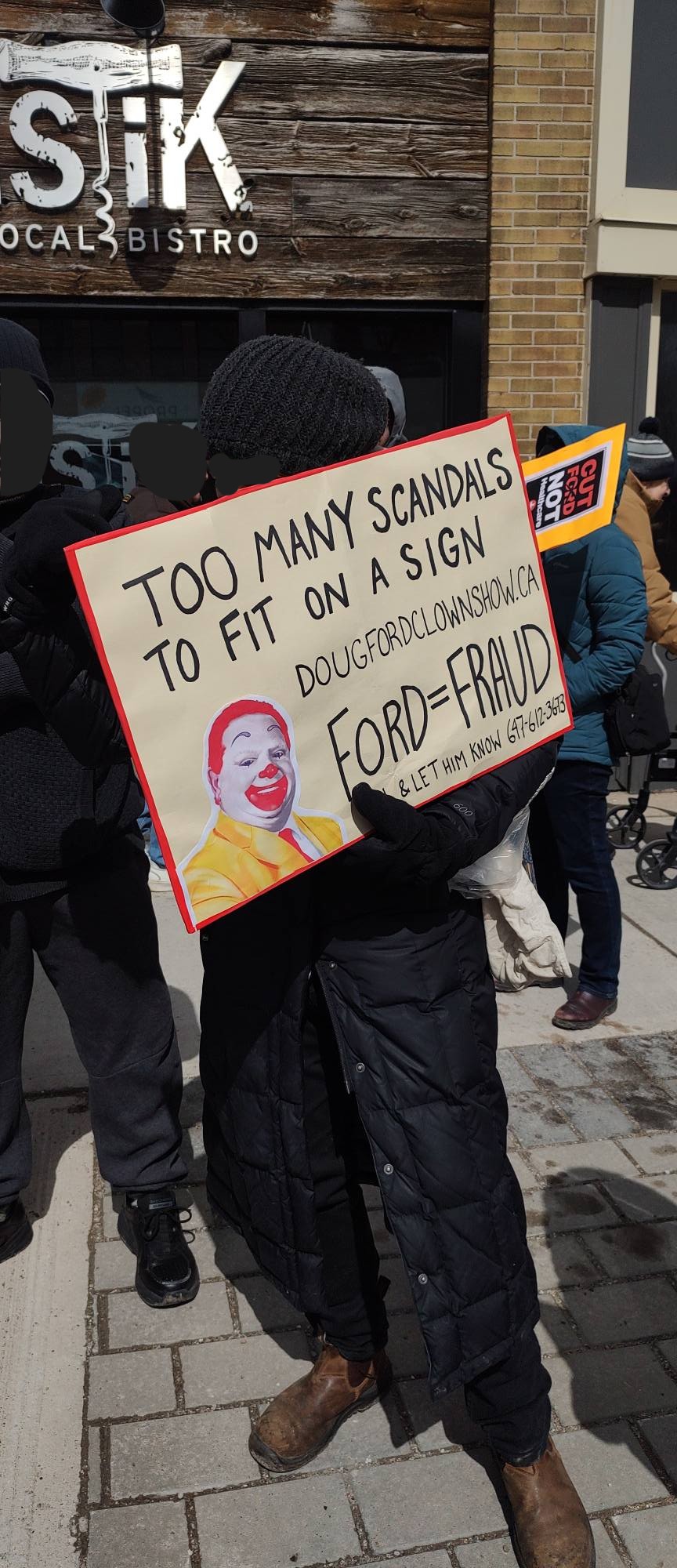 protest poster "too many scandals to fit on a sign. ford = fraud"